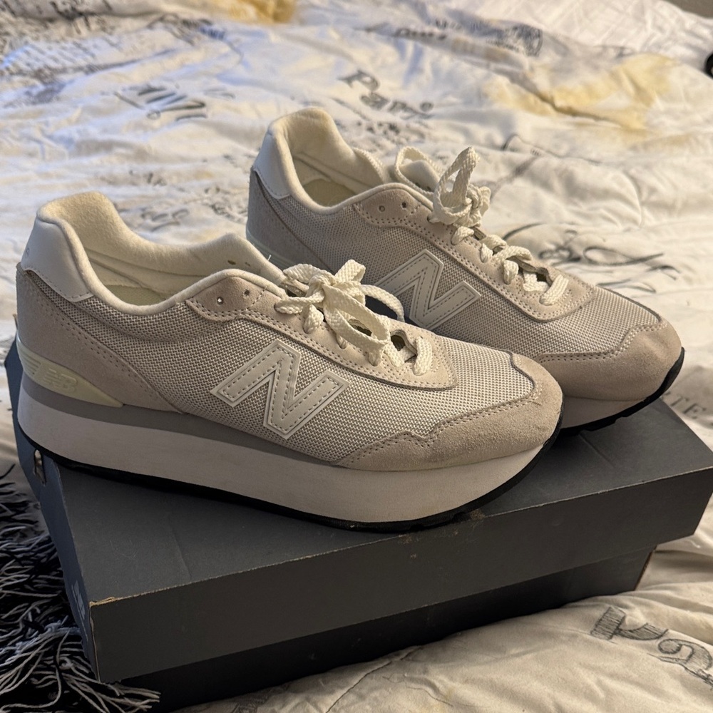 New Balance Women's White Sneakers. Has shades of light gray.